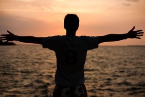 + man arms wide open beach June 12 5265188_s