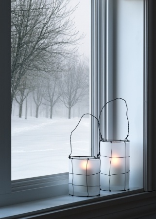 snowy-outside-candles-windowsill
